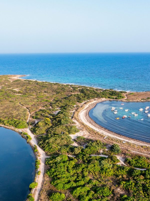 vista aerea della spiaggia di torre colimena al tramonto, in estate - Salento, Puglia, Italy